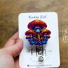 il_fullxfull.5229495541_ma75 Whimsical Mushroom Retractable Badge Reel: Colorful Fantasy ID Holder for Nurses & Food Service