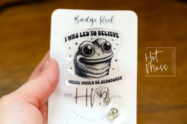 I was told there would be Serotonin Badge Reel, Frog Badge Reel, Retractable Acrylic Badge Reel, Mental Health, Therapist ID Holder