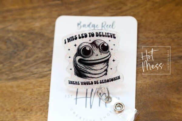 I was told there would be Serotonin Badge Reel, Frog Badge Reel, Retractable Acrylic Badge Reel, Mental Health, Therapist ID Holder