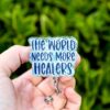 il_fullxfull.7311190732_higl The world needs more healers Badge Reel, Throne of Glass ID Holder, Nurse Badge Reel, Book Lovers, Booktok, TOG, Stocking Stuffer